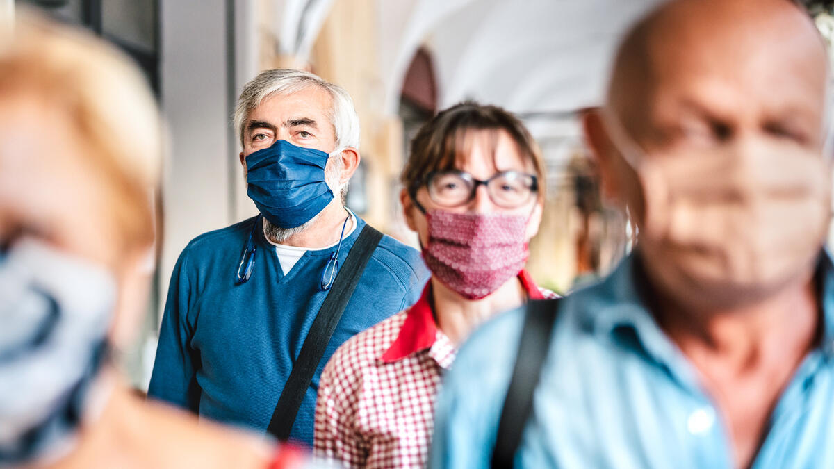 A group of senior citizens with masks